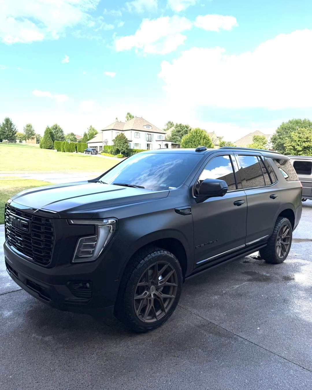 Matte black GMC Yukon after an exterior detail