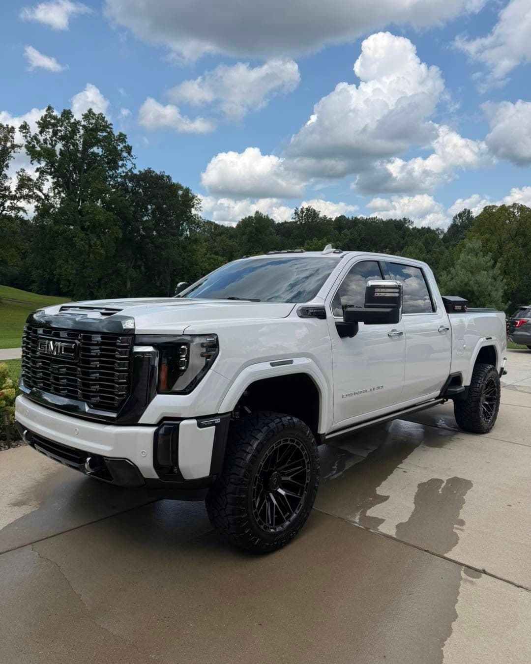 White lifted Denali HD after an exterior detail