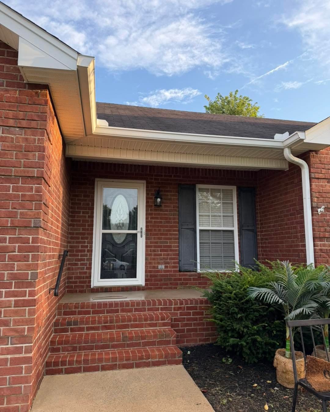 Brick entry and soffit after a wash