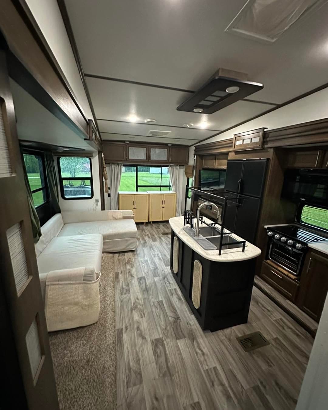 Fifth wheel living area and kitchen after an RV interior detail