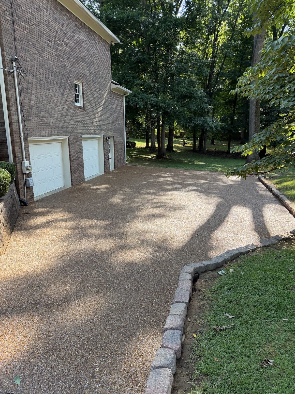 Sealed driveway after cleaning and sealing